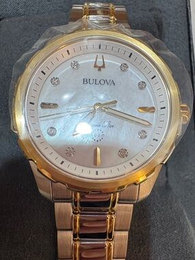 Bulova Gold and Silver Mother-of-Pearl Dial Watch with Diamond Accents